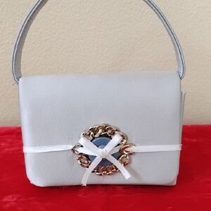 NWOT Elegant  Light Blue Handbag with Gold Accent